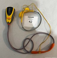 Full view of Sony Sports Walkman with original yellow headphones and patterned cord