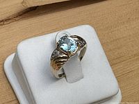 Oblique front view of ring on white stand