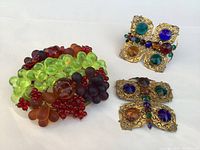 Fruit glass lamp top and two jeweled butterfly embellishments on white background