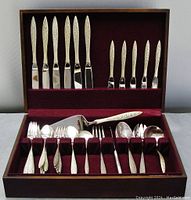 Full 40-piece set in wooden box with burgundy felt lining