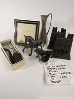 Full lot group photo showing all items including cathedral motif bookends, metal horse figurine, small jug, photo frame, and boxed Tru-Pit pipe