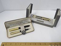 Full view of the Waterman's Elysée pen set with original case and packaging showing two pens held in a cream satin-lined case.