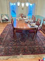 Overall shot with dining table showing full rug dimensions and fringe