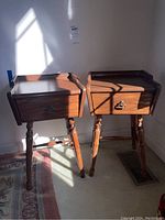 Two matching side tables side by side against a wall showing overall design and finish