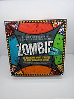 Front view of the Zombie Road Trip board game box with colorful and thematic design.