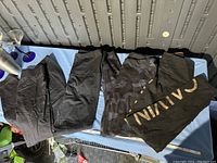 Four pairs of women’s medium leggings laid out flat on a surface, showing different styles and branding.