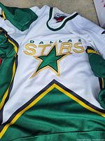 Front detail of the Dallas Stars logo and jersey design including colors and stitching