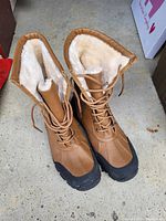 Top view of brown Outback boots showing fleece interior lining and lace up front.