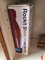 Box of Rockit Shine Water Bottle with image of copper-colored water bottle on the side