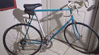 Full side view of vintage Schwinn Tempo road bike showing frame, wheels, seat, and handlebars.