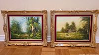 Two vintage paintings side by side, framed in decorative gold and burgundy frames, showing landscape artwork by Cerbone.