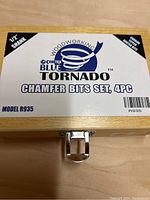 Photo of the wooden box lid showing the brand name 'Craftex Blue Tornado' and details: 1/2" shank, carbide tipped router bits, chamfer bits set 4pc, model R935