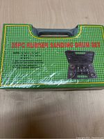 Green case for 25-piece rubber sanding drum kit with product details and image showing kit components