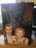 Complete Thin Man DVD collection box front with illustrated characters and dog.