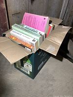Box full of novels showing spines and covers, featuring Maeve Binchy titles and others.