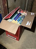 Closed top view of cardboard box filled with novels.