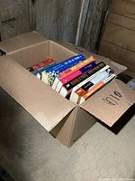 Box open showing a variety of novels stacked inside.