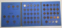 Three-page view of blue Whitman folder showing Flying Eagle and Indian Head cent slots with coins and empty spaces