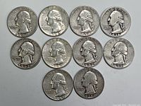 Obverse side of 10 silver Washington quarters featuring George Washington's portrait with visible mint dates from 1935 to 1964.