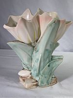 Side view of the McCoy pink blush tulip vase showing the detailed petals and leaves with soft pink, yellow, and green glaze.