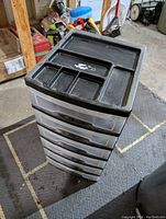 Black 6-drawer plastic storage unit with molded top organizer compartments