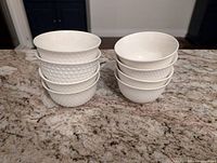 Stacked bowls showing two distinct surface patterns: dot texture and diamond texture.