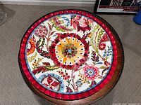 Top view showing colorful floral and bird pattern on platter