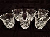Photo showing six Waterford crystal glasses arranged in two rows, highlighting the intricate Ballyshannon cut pattern.