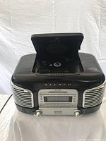 Black Teac vintage style radio and CD player with top-loading CD tray open showing interior.