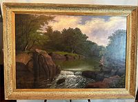 Full front view of the oil on canvas landscape in ornate gilt wood frame.