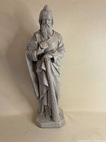 Front view of the full statue showing St. Jude holding a book and staff, standing on a base.