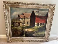 Photo showing framed painting of waterfront buildings titled 'East Rockaway' by Dorothy Hope Smith, colors and style visible clearly, frame included.