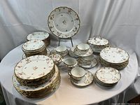 Overall view of full set arranged on table, showing all pieces and pattern consistency.