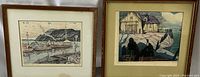 Both framed prints "Anxiety" and "House Boats On The Cabano" displayed side by side on stands showing full artwork and frames.