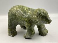 Front-side view of green soapstone bear sculpture