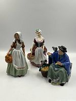 All three Royal Doulton figurines displayed together on white background