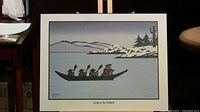 Print titled "Going to the Potlatch" showing four figures paddling a canoe in a snowy landscape with pine trees in silhouette against a gray background.