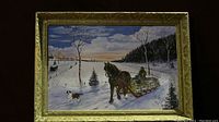 Full view of folk art oil painting with gold frame showing winter sleigh scene with horse and dog.