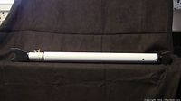 Full view of the Master Lock Adjustable Door Security Bar showing the white metal bar and black plastic end pieces