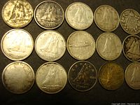 15 silver Canadian dimes arranged in 3 rows showing obverse and reverse sides with dates visible from 1944 to 1965.