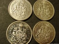 Obverse side showing Canadian coat of arms on four 50 cent coins.