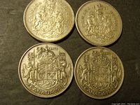 Reverse sides of four Canadian 50 cent silver coins showing crowned Canadian coat of arms with years 1942, 1951, 1961, and 1963