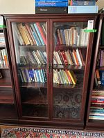 Front view of closed display case with books inside