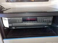 Front view of the Technics SL-PD8 CD player sitting in a shelf with visible digital display panel and buttons.