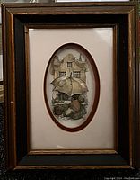 Full view of framed 3D artwork with worn frame.