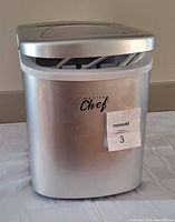 Front view of silver Master Chef ice maker with the brand logo visible and a MaxSold sticker.