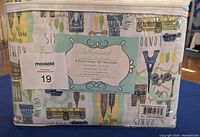 Zippered clear bag packaging showing folded colorful printed sheet set with visible label describing contents.