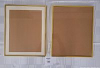 Photo of two assorted picture frames, one with white mat and gold-edge border, the other with plain gold border, both with cardboard backings.