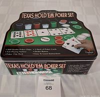 Closed box of Cardinal's Professional Texas Hold'em Poker Set highlighting included items and branding.