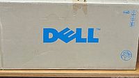 Closed view of original Dell cardboard box for printer, with Dell logo prominently displayed.